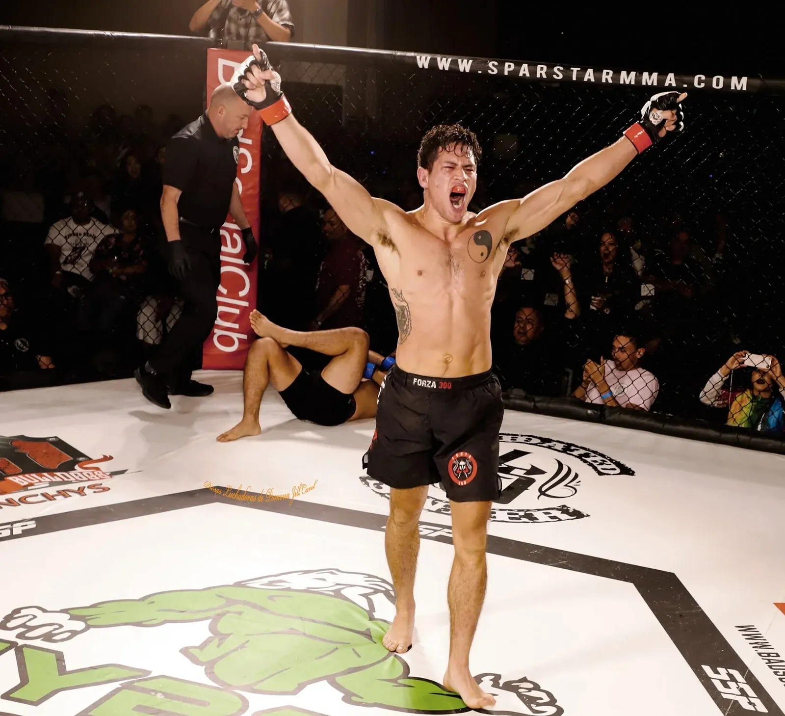 Johnny Faris celebrating a win in the cage