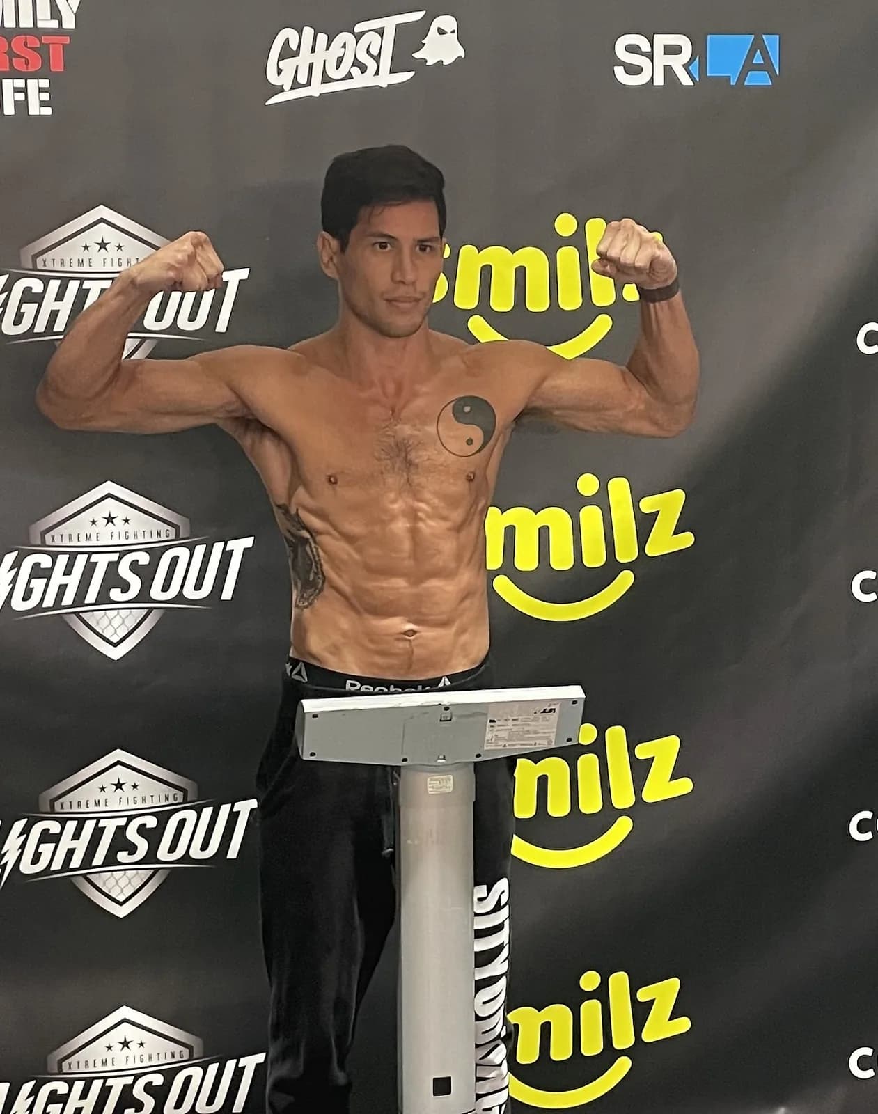 Johnny Faris on the scale at a professional boxing weigh-in