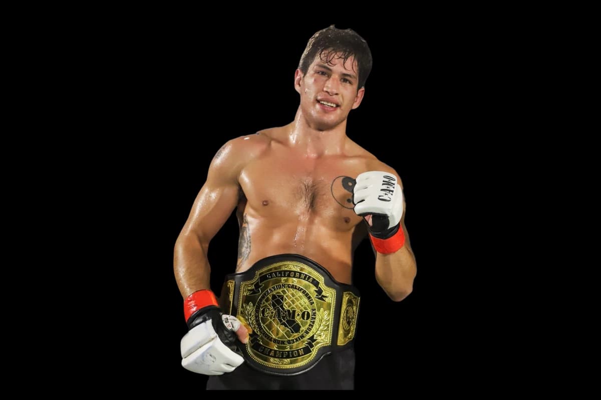 Johnny Faris with championship belt and gloves representing boxing and kickboxing training